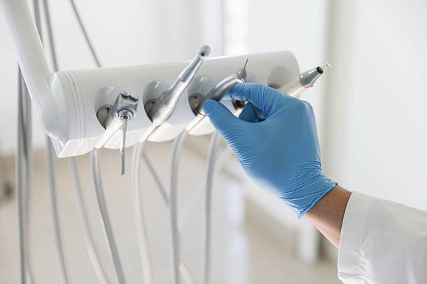 Professional Tooth Extraction technician working in Montgomery Village, MD